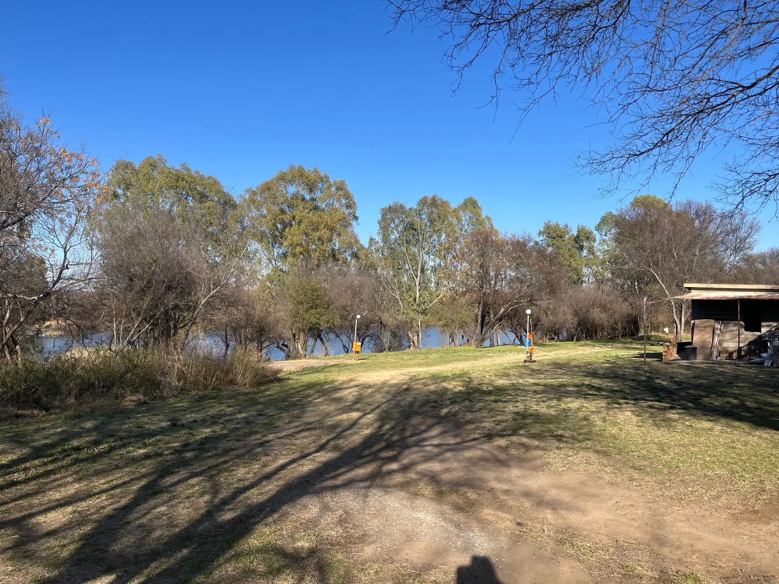 Open riverside grounds at Raaswater River Lodge